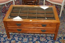 AN OAK GLASS TOPPED COFFEE TABLE, with two long drawers, approximate size width 100cm x depth 60cm x