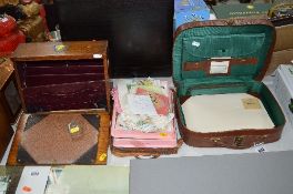A SMALL SUITCASE, CONTAINING FITTED WRITING COMPARTMENTS AND BLOTTER, together with a desk stand