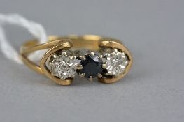 A MID TO LATE 20TH CENTURY GOLD SAPPHIRE AND DIAMOND RING, two eight cut diamonds illusion set,