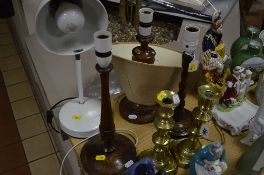A PAIR OF BRASS CANDLESTICKS, and four various lamp bases and a shade