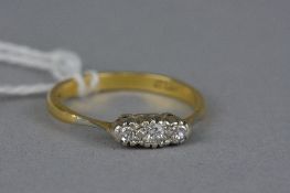 AN EARLY 20TH CENTURY DIAMOND HALF HOOP RING, three round cut diamonds, approximate estimated weight