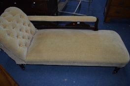 A VICTORIAN UPHOLSTERED CHAISE LONGUE, on metal casters