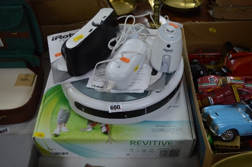 A IROBOT ROOMBA VACUUM CLEANING ROBOT, together with a boxed Revitive circulation booster (2)
