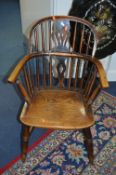 A GEORGIAN AND LATER ELM AND OAK SPINDLE BACK WINDSOR ARMCHAIR, with splat back on turned legs and