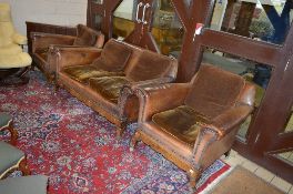AN ART DECO WALNUT VENEERED PARQUETRY INLAID AND BROWN LEATHER THREE PIECE SUITE, comprising of a
