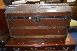 A VINTAGE DOMED TOPPED TRUNK, with metal and wooden banding, J. Ingram refs, Trunk & Bag Depot, 54