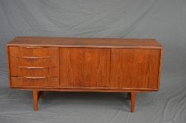E. W. BACH FOR SEJLING SKABE OF KOLIND, DENMARK, a teak 1960's sideboard, flanked with four