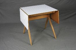 A FRANK GUILLE FOR KANDYA 1950'S FORMICA TOPPED DROP-LEAF TABLE, on beech cross framed legs,