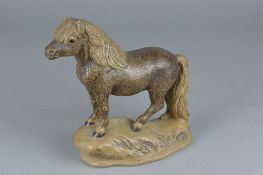 A POOLE POTTERY BARBARA LINLEY ADAMS STONEWARE FIGURE OF A NEW FOREST PONY STANDING ON A MOUND,