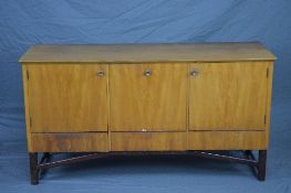 MEREDEW TEAK SIDEBOARD, with three short drawers below a fall front section central to two
