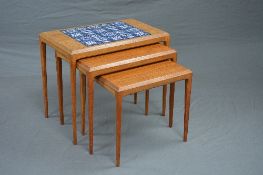 JOHANNES ANDERSON FOR SILKBORG, a teak 1960's nest of three tables, the largest table inlaid with