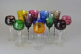 TWO SETS OF SIX HARLEQUIN WINE GLASSES, the first having flash cut bowls with internal matching