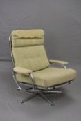 A SCANDINAVIAN STYLE CHROME FRAMED SWIVEL RECLINING ARMCHAIR, with mesh seats and back, covered with