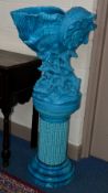 A BURMANTOFTS TURQUOISE GLAZED JARDINIERE STAND, of cylindrical column form, moulded with seaweed