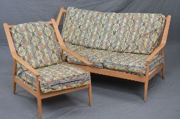 A DANISH MID 20TH CENTURY STYLE TEAK TWO PIECE LOUNGE SUITE, with spindled back to a swept armrest
