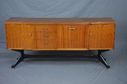 A STONEHILL GIO PONTI STYLE TEAK AND ROSEWOOD FINISH BREAKFRONT SIDEBOARD, flanked by three