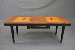 A MID 20TH CENTURY TEAK, WALNUT AND BRASS BANDED COFFEE TABLE, inlaid with dancing ballerinas,