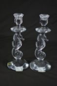 A PAIR OF WATERFORD CRYSTAL SEAHORSE CANDLESTICKS, one having the gold foil label on the top of