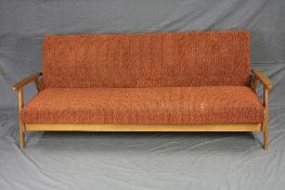 A TEAK DANISH STYLE SOFA/BED, on an 'A' framed style legs to an arm rest, approximate size height to