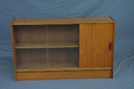 A DANISH STYLE TEAK BOOKCASE, with glazed sliding doors, the fall front section and cupboard door,