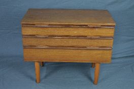 AN AVALON TEAK CHEST OF THREE GRADUATED DRAWERS, on four triangular shaped legs, approximate size