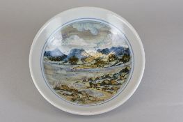 A LARGE HIGHLAND STONEWARE BOWL, decorated with a scene of river, trees and mountains in the