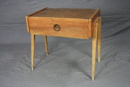 A MID 20TH CENTURY WANUT DANISH/AB CARLSTROM STYLE BEDSIDE TELEPHONE TABLE, with a fall front door