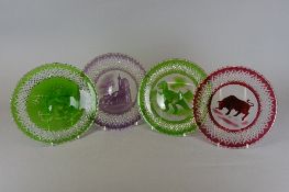 FOUR SUN CATCHERS, flash cut and decorated with unusual designs, including a Tyrannosaurus Rex and a