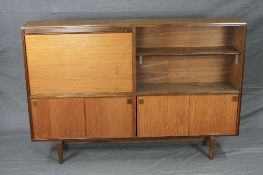 ROBERT HERITAGE, BEAVER & TAPLEY TEAK BOOKCASE/COCKTAIL CABINET, with combination of wooden and
