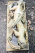 A GIBBS & CANNING SCULPTURE OF TWO LIZARDS, entwinned possible an Architectural door plaque, 107cm