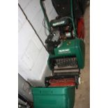 A QUALCAST CLASSIC PETROL 35S CYLINDER LAWN MOWER, with attachment and grassbox