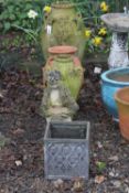 TWO CLAY GARDEN EWERS, a terracotta planter, a composite figure of a boy and a lead look planter (