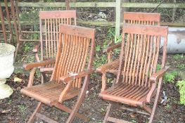 A SET OF FOUR WOODEN FOLDING GARDEN CHAIRS, Sun Time label to rear