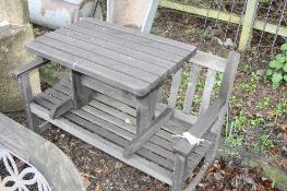 A MODERN WOODEN GARDEN BENCH WITH SIDE TABLE, 120cm long (2)