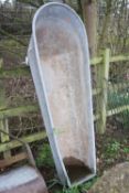 A TAPERED AND CURVED GALVANISED VINTAGE TROUGH, 170cm long