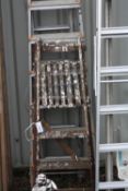 A SET OF ALUMINIUM EXTENSION LADDERS, 300cm long, an aluminium step ladder, 210cm long and a