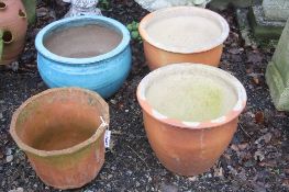 A LARGE GLAZED GARDEN PLANTER, a terracotta planter and two other planters (4)