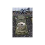 A PAIR OF SANDSTONE COLUMN BASES/TOPS, with foliage corners, 46cm square at base, 28cm diameter at