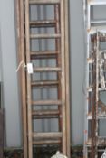 THREE SETS OF WOODEN EXTENSION LADDERS, 284cm long