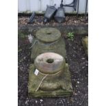 A PAIR OF SANDSTONE COLUMN BASES/TOPS, with foliage corners, 46cm square at base, 28cm diameter at