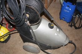 A WAP SILVER W 62303 PRESSURE WASHER, with long hose and reel attached