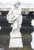 A LARGE COMPOSITE FIGURE OF A BOY WITH A BASKET OF GRAPES, on separate plinth, 153cm high