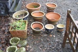 SIX GLAZED, TWO TERRACOTTA AND ONE COMPOSITE GARDEN PLANTERS,together with a pair of boot