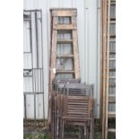 FOUR WOODEN FOLDING GARDEN CHAIRS, and two sets of wooden step ladders, 186cm high (6)