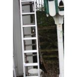 A SET OF ALUMINIUM EXTENSION LADDERS, 304cm long and a set of wooden extension ladders 344cm long (