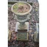 A CAST IRON CAMPANA URN, on square column base, standing 110cm high x 45cm diameter, urn top