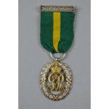 A GEORGE V TERRITORIAL DECORATION, silver and silver gilt, hallmarked to reverse