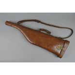 A LEG OF LAMB STYLE BROWN LEATHER GUN CASE, all intact with straps, carrying handle, etc, no