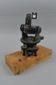 A BRITISH MADE A.M. ASTRO COMPASS MKII, 6A. 1174. 3-H, this compass is mounted on a wooden plinth,