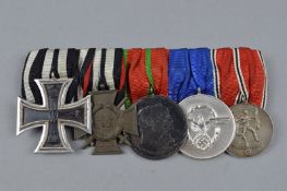IMPERIAL GERMANY WWI/WWII GROUP OF MEDALS, on a wearing bar, consisting Iron Cross, 2nd Class, 1914,